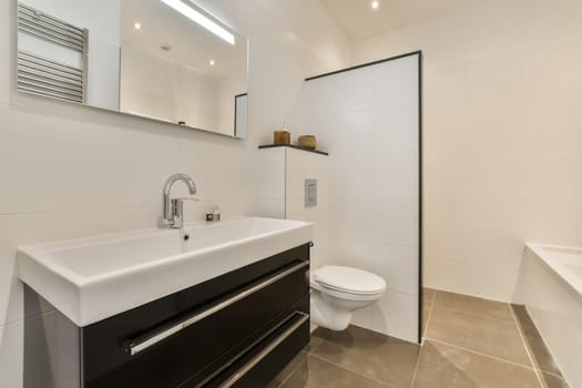 a bathroom with a sink and toilet and a shower