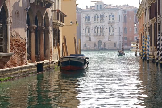 Picturesque channels of Venice. Boats, transport links. Venice, Veneto region, Italy - September 2023: Canal in Venice. Traditional architecture of Venice