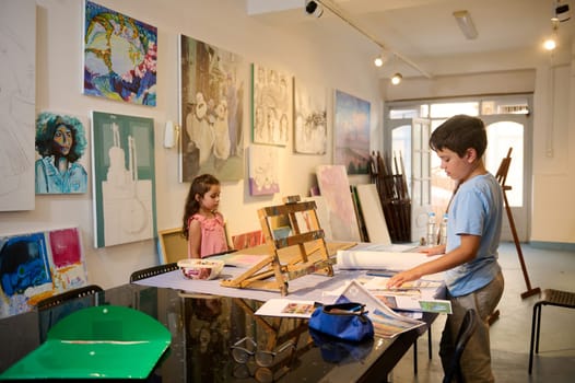 Adorable diverse kids learning painting and drawing at fine art class. People. Children. Education. Visual art concept