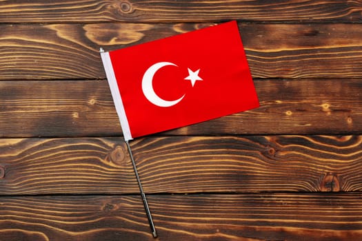 Flag of Turkey on wooden background close up