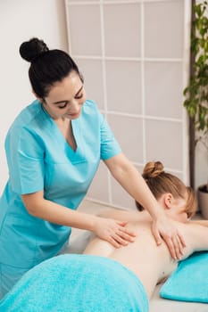 masseur does back massage healthy back relaxation healing osteopathy