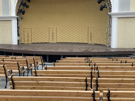 empty stage for a performance on the street many benches