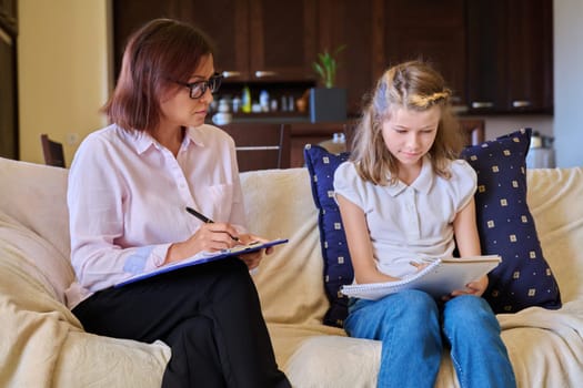 Individual therapy session for child girl with psychologist.