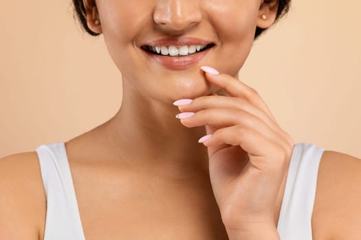 Cropped Of Young Indian Woman With Beautiful Smile Touching Chin With Hand