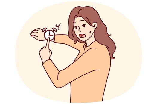 Stressed woman point at clock frustrated by deadline