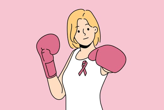 Woman fights cancerous tumor using boxing gloves and resisting development breast cancer
