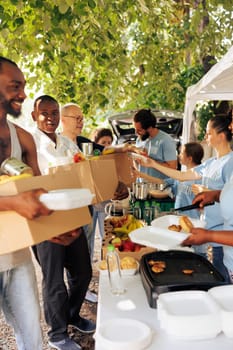 Helping needy: Food distribution outdoor