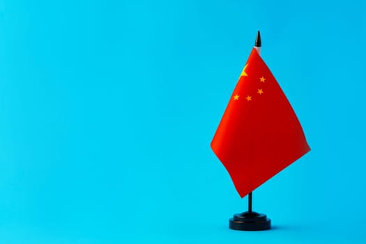 Flag of China on color background close up