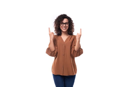 young positive cheerful slender woman with curls dressed in a brown blouse