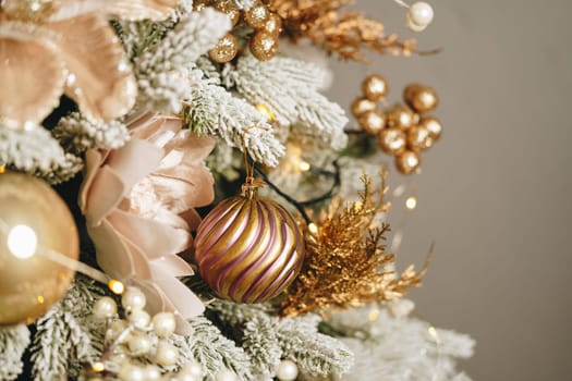 Beautiful Christmas tree with golden balls decor close up