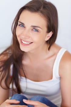 Portrait, woman and relax with a smile, casual and happiness with weekend break, joy and home. Aesthetic, face and person with positivity, human and girl with peace, calm and cheerful in a lounge