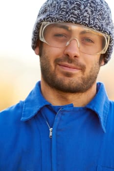 Man, construction worker and portrait for protection eyewear for building repair, maintenance in industry. Male person, face and glasses or safety gear as handyman contractor on site, outdoor for job