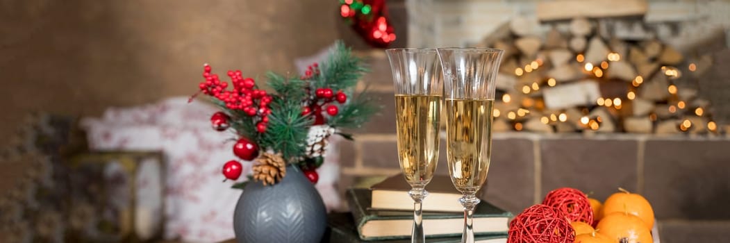 glasses for champagne, Christmas time decorations, New Year dinner, luxury home interior.Champagne and new year decor. cozy home, ready for winter holidays