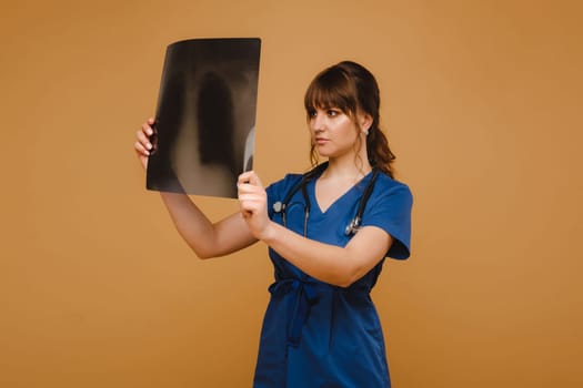 Female Brunette Doctor Looking at Tomography X-ray Film