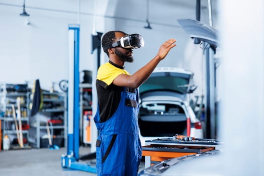 Repairman fixes car battery with VR