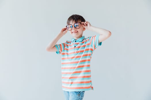 Boy in glasses to improve vision smiling