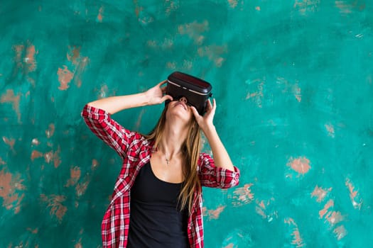 Woman in virtual reality headset enjoying her experience