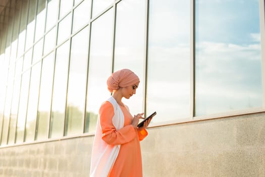 beautiful arabian girl with tablet computer. Muslim woman.