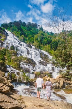 Couple visit Mae Ya Waterfall Doi Inthanon national park Thailand Chiang Mai
