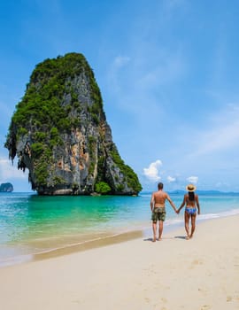 Railay Beach Krabi Thailand, a couple of men and woman on the beach in Thailand