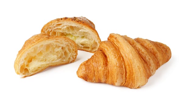 Croissant cut in half isolated on white background