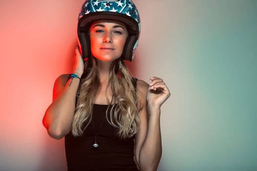 Stylish fashionable biker girl in helmet