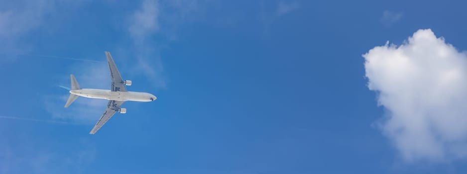 An Airplane Soaring Through the Vast Blue Sky