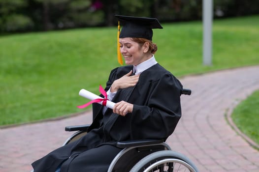 A caucasian woman in a wheelchair holds her diploma and cries with joy outdoors.