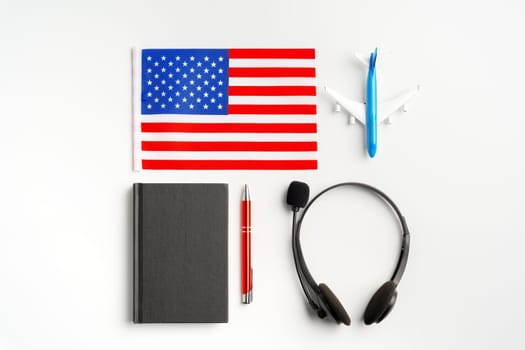 Flag of USA and headset on white background