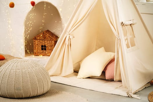 Children's room with play tent teepee and pillows
