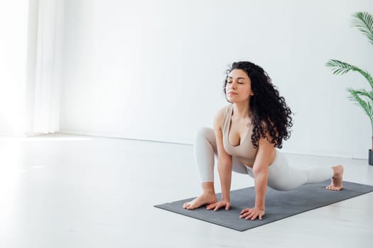 Beautiful woman doing exercises yoga asana gymnastics