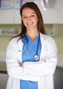 Happy woman, portrait and veterinarian professional doctor at clinic for animal care, shelter or healthcare service. Female person, nurse or pet surgeon smile with arms crossed in confidence at vet