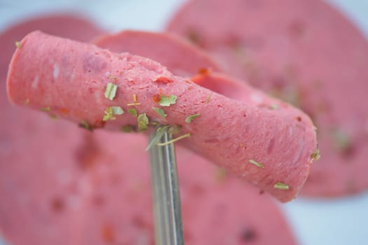 salami sausage cut into thin pieces