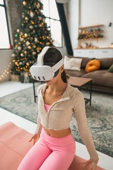 During the New Year festivities, a yoga instructor hosts online training sessions using a virtual reality headset.