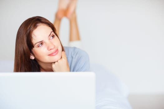 Home, woman and thinking with a laptop, ideas and happiness with mockup space, relax and network. Person, apartment and girl with a pc, peaceful and planning with problem solving, calm or digital app.