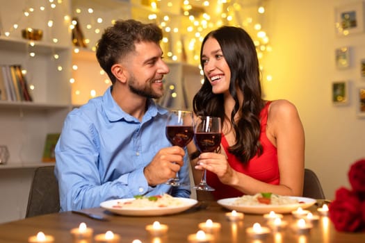 Couple toasting wine on a romantic dinner
