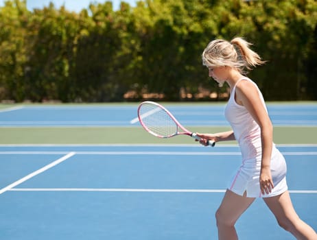 Tennis, sport or woman with racket on court for competition, match or training outdoor and sportswear. Player, person or game and exercise, workout or competitive with wellness for fitness in summer
