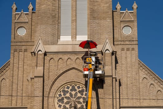Repair work with powered lift to brickwork of St Joseph in Greenville MS