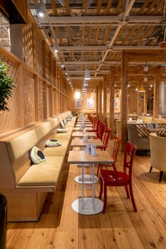 Loft style restaurant with textured wooden walls. Cafe in wooden style