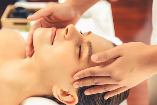 Closeup woman enjoying relaxing anti-stress head massage. Quiescent