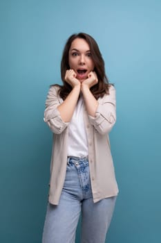 surprised shocked young brunette female adult in casual shirt