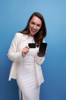 well-groomed brunette woman in office dress with card mockup