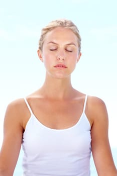 Meditation, exercise and woman breathing in yoga with peace, zen and healthy mindset on blue sky. Calm, person and holistic mindfulness from chakra, practice or morning routine for stress relief
