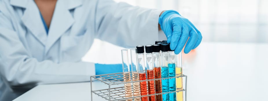 Laboratory researcher develop new medicine using colorful chemical. Rigid
