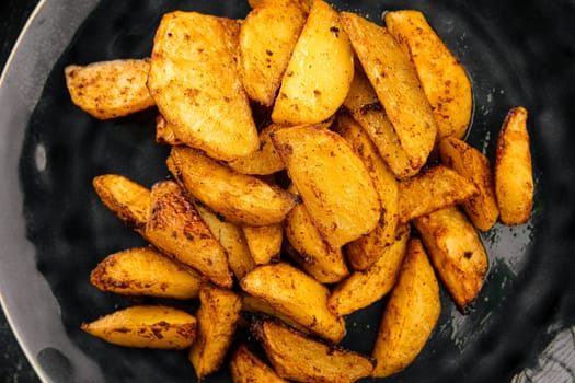 Portion of baked potato wedges