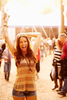 Outdoor sunshine, music festival portrait and excited woman scream, happiness and celebrate at social event. Lens flare, summer heat and girl energy, celebration and happy for concert performance.