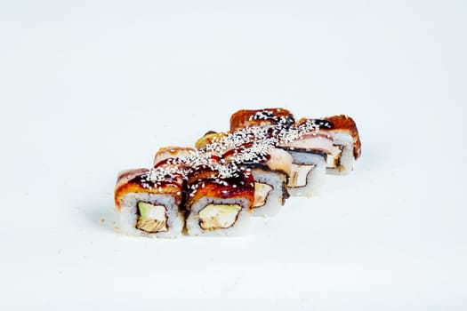 Japanese food Sushi rolls with fish on a white background