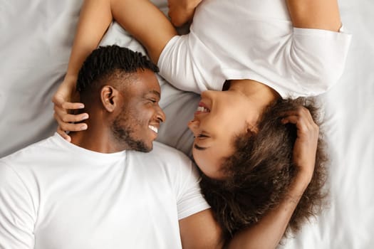 Black Lovers Couple Lying Hugging In Bed Indoor, Top View