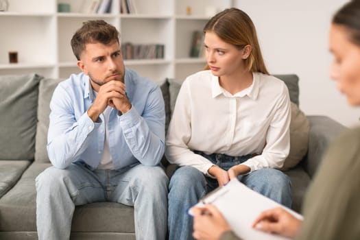 Young couple having therapy session to navigate marital issues indoor