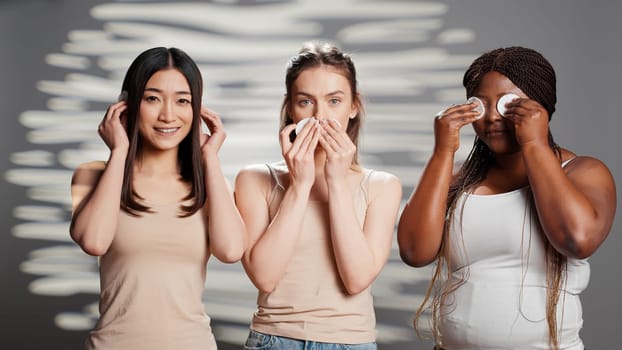 Young models doing three wise monkeys sign